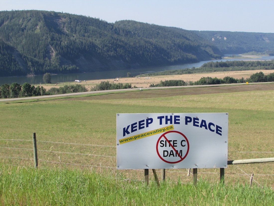 Signs protesting the Site C dam are plentiful along Highway 29 between Fort St. John and Hudson's Hope. Photo credit: Emma Gilchrist, DeSmog Canada.