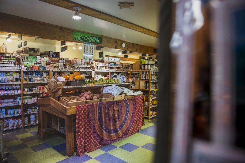 What is COVID's impact on local tourism to Cortes Island and businesses like to Natural Food Coop?