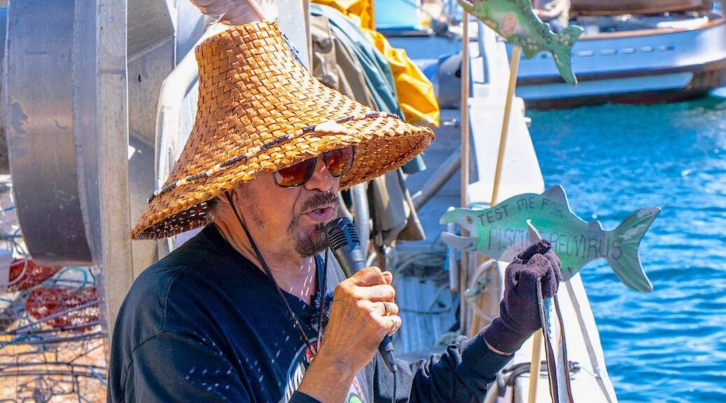 Hereditary Chief George Quocksister Jr. speaks at a protest flotilla at a Discovery Islands salmon farm in May calling on DFO to refuse permission to restock sites in the region.