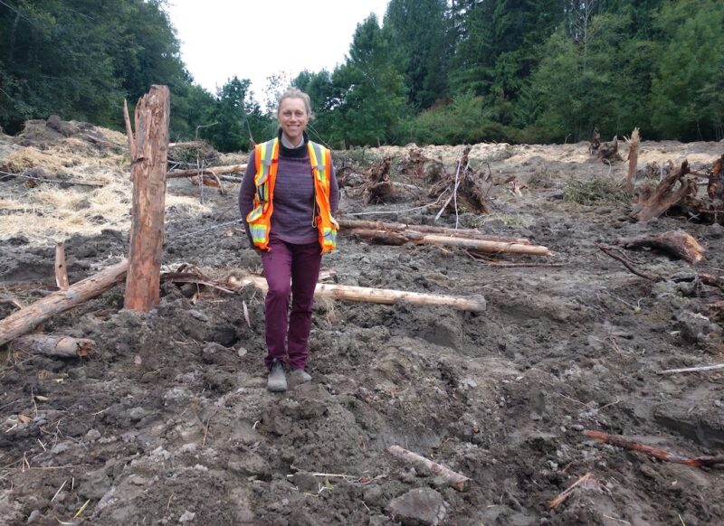 Miranda Cross standing in the freshly constructed wetland at Dillon Creek.