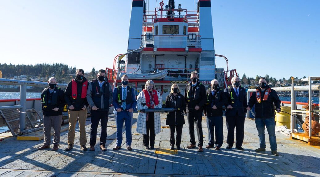 Group of people on board cable laying ship