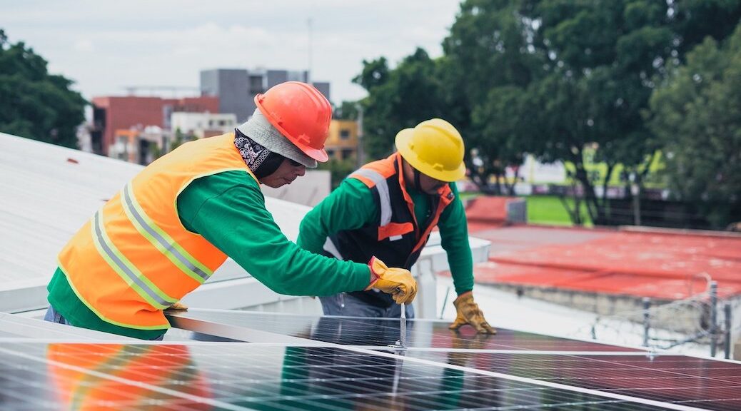 Two men working on a solar installation