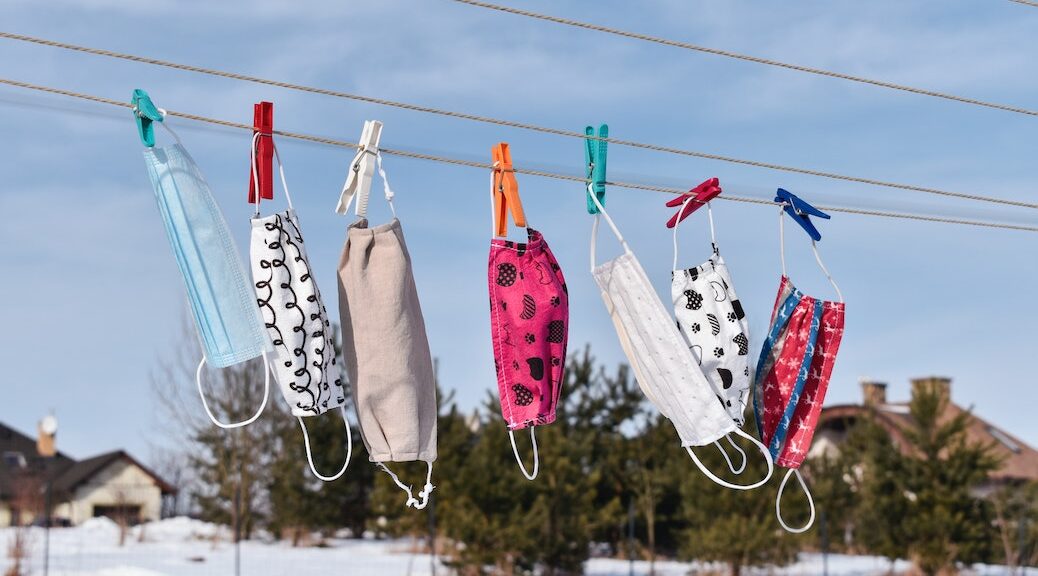 COVID masks hanging on a clothesline