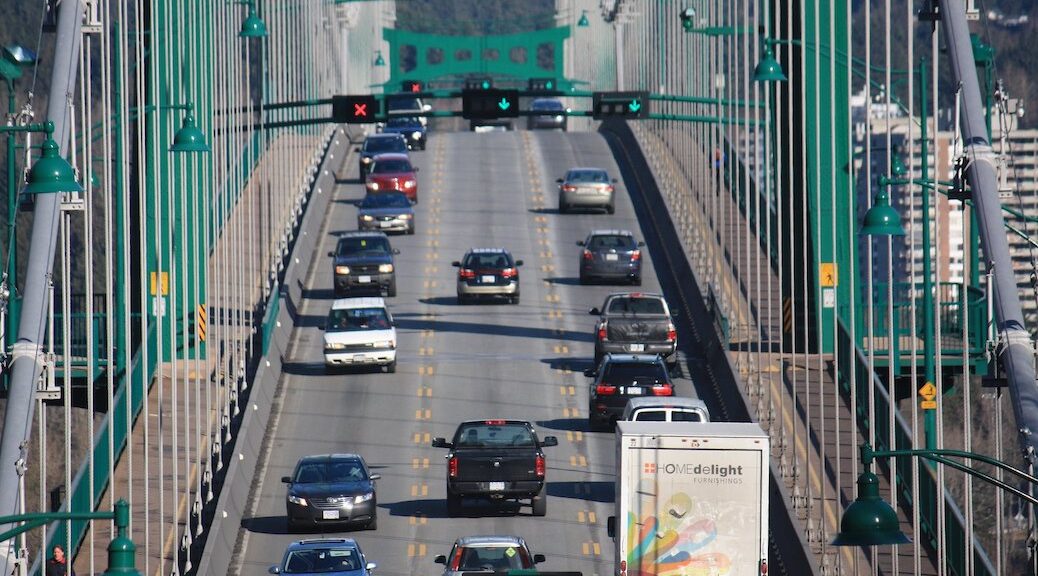 cars driving across the Lions Gate bridge