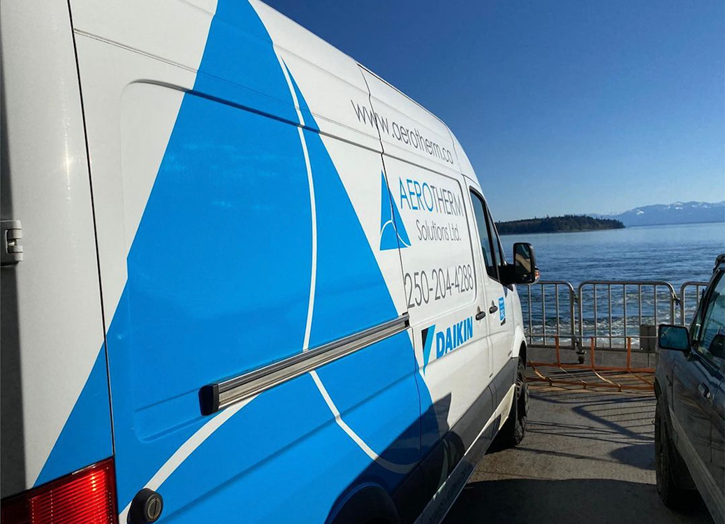 van on a ferry looking back to land
