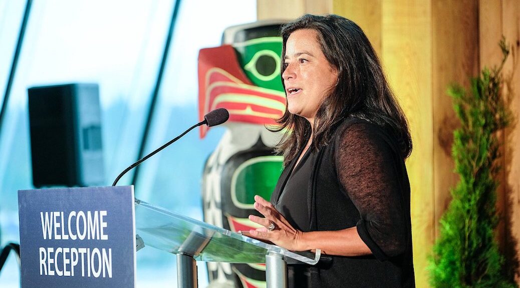Indigenous woman speaking at a podium