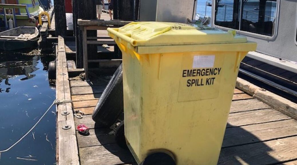 Yellow garbage bin sitting on a dock