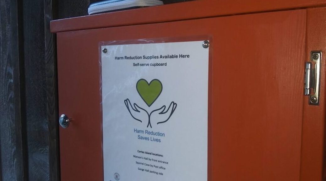 Am orange box with 'Harm reduction saves lives' on the side
