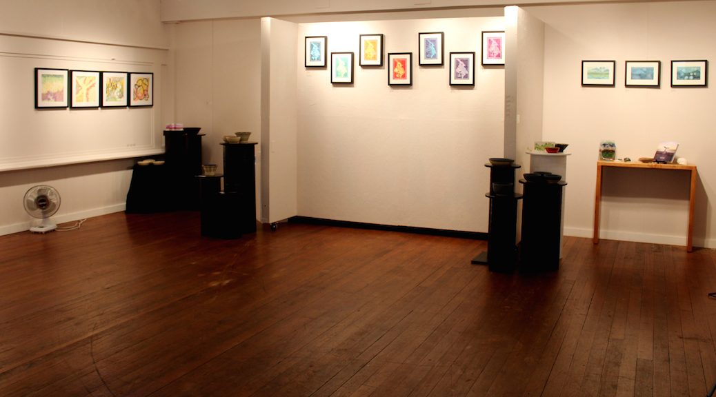 A gallery with works of art on the walls