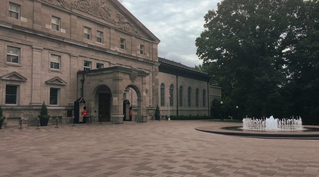 Grand entrance to a three story Georgian style stone building