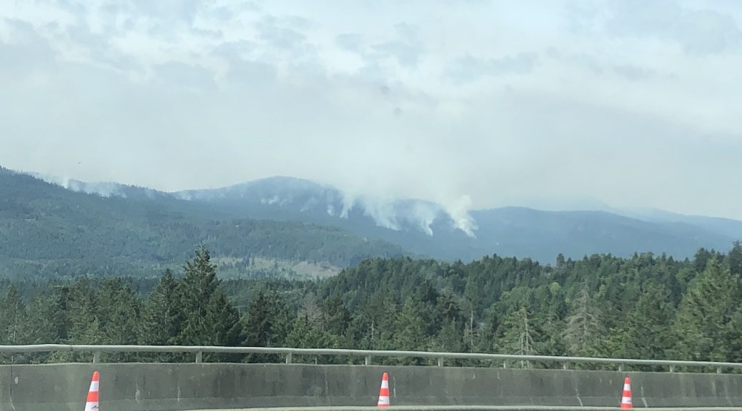 Plumes of smoke from the Cameron Lake Wildfire seen from the Inland Island Highway