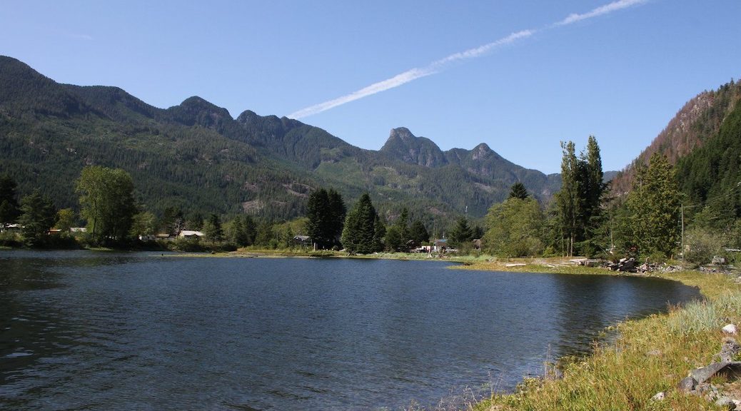 Looking out at the mountains behind a lake