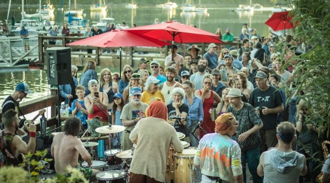 Band looking out to a crowd at Gorghe Harbour Marina