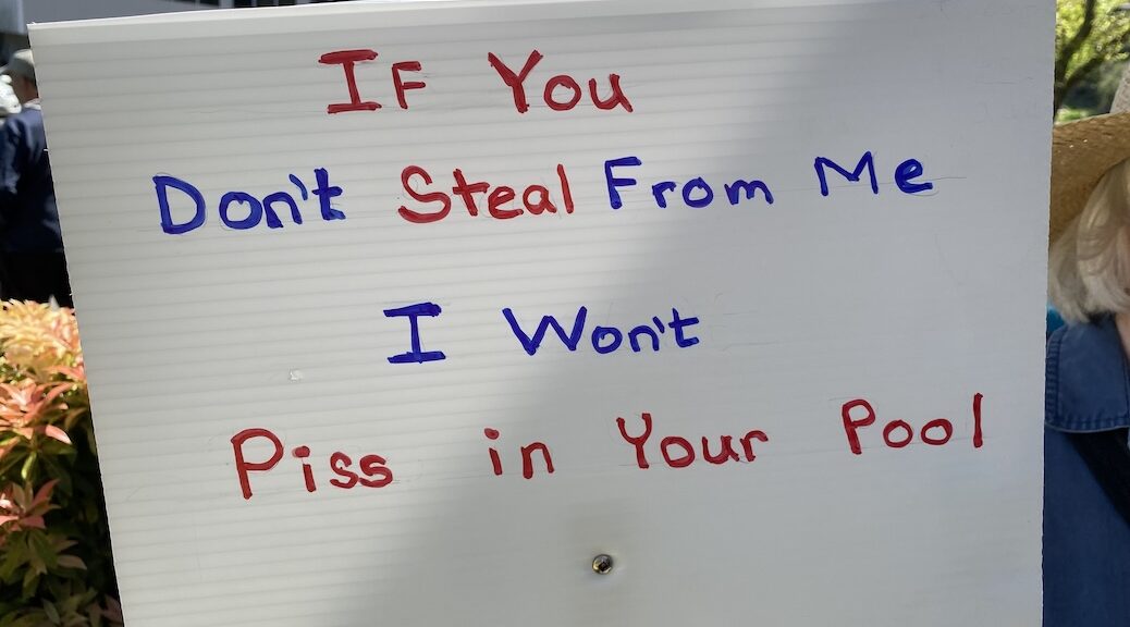 Quadra residents sign says if you don't steal from me I won't piss in your pool
