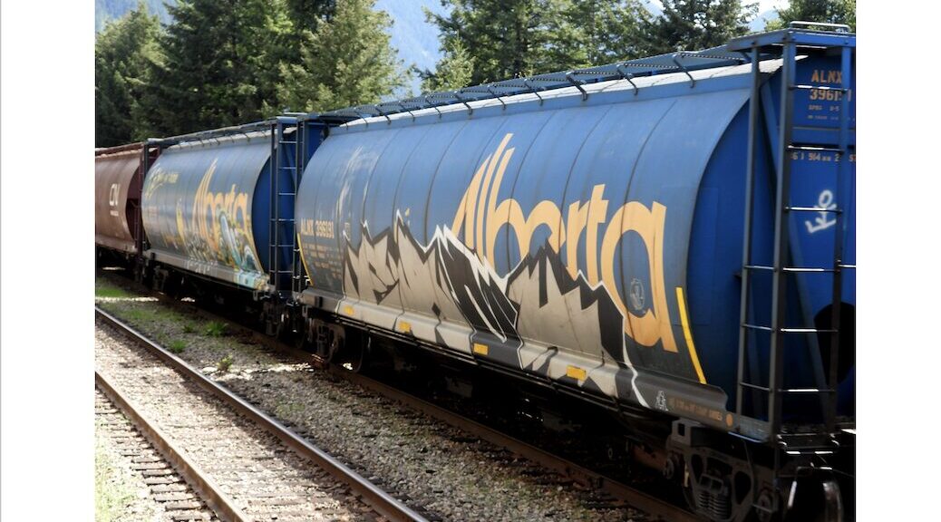 Two oil cars with the words Alberta written on the side