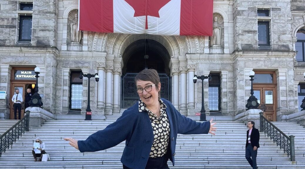 Robyn Mawhinney giving a show biz finale on the steps of the BC legislature
