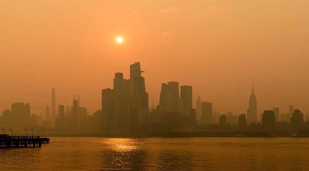 A smog filled profile of New York seen from the ocean